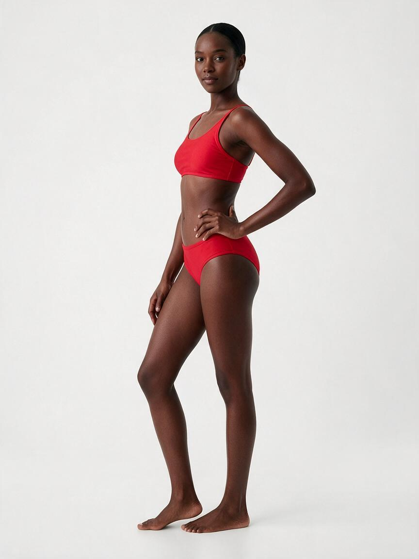 Modelo adulta do catálogo do Ensaio, gerada por computador, que não representa nenhuma pessoa real, vestindo um conjunto de moda praia em foto de estúdio